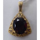 A 9ct gold pendant, set with an oval cut smoky quartz