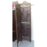 A 20thC Middle Eastern hardwood, three-fold roomscreen  70"h  54"w open