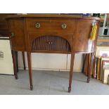 An Edwardian reproduction of a Regency mahogany bow front sideboard with string inlaid ornament,