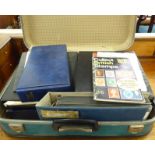 A vintage suitcase containing uncollated First Day Covers