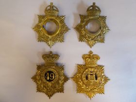 Military helmet plates, 49th Dorsetshire and two without mounts (Please Note: this lot is subject to