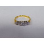 An 18ct gold five stone diamond ring