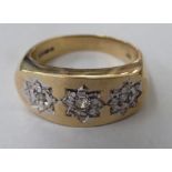 A 9ct gold gypsy ring, set with three groups of diamonds shaped as starbursts