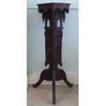 A late 19thC Anglo-Indian profusely carved and pierced teak torchere, the hexagonal top with a