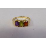 A 9ct gold ring, set with three variously coloured stones