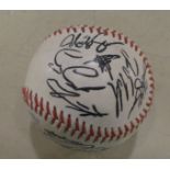 A baseball bearing numerous signatures