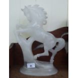 A carved alabaster model, a rearing horse, on an oval plinth  14"h