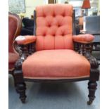 A late Victorian oak and mahogany showwood framed salon chair, upholstered in red fabric, raised