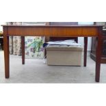 A modern mahogany writing desk, raised on square, tapered legs  36"h  54"w  29.5"deep