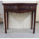 A late 19th/early 20thC rosewood and mahogany serpentine front, single drawer card table, raised