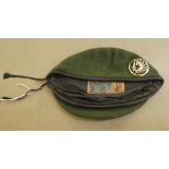 A French Foreign Legion green beret with a white metal emblem and Plein Ciel label (Please Note: