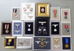 Variously presented, mainly German World War II related military uniform badges and other