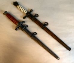 A German army design dagger with a wrythen moulded handgrip, oakleaf mounts and a spreadeagle with