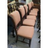 A set of six early 20thC mahogany framed dining chairs, later fabric upholstered, raised on ring