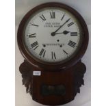 A late 19thC and later mahogany cased drop-dial wall clock with a turned surround and pendulum