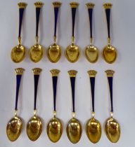 A set of twelve Ela Denmark Sterling silver gilt and midnight blue enamel coffee spoons with cast