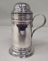 A George III silver cylindrical sander with a perforated cover and loop handle  bears a contemporary