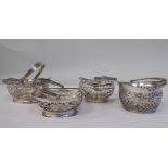 Four similar 19thC Continental silver coloured metal miniature sweet baskets with variously