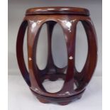 A 20thC Oriental mahogany framed open barrel design stool with inlaid mother-of-pearl decoration