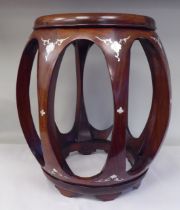 A 20thC Oriental mahogany framed open barrel design stool with inlaid mother-of-pearl decoration