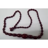 A cherry amber coloured graduated bead necklace