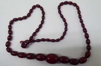 A cherry amber coloured graduated bead necklace