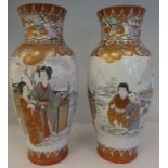 A pair of late 19th/early 20thC Kutani porcelain baluster shape vases, traditionally decorated in