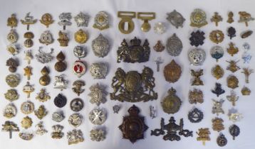 Approx. fifty-five military cap badges and other insignia, some copies: to include Lowland Regiment;