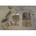 Sterling silver cutlery and flatware, on decoratively cast bell flowers and scrolled handles, viz.