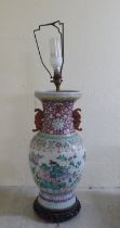 A late 19thC Chinese porcelain table lamp of waisted form, decorated in pastel tones with birds