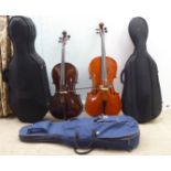 A modern quarter size and a half size cello with fabric carrying cases; and another (empty) fitted