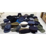 Hats: to include military helmets, peaked caps and berets (Please Note: this lot is subject to the