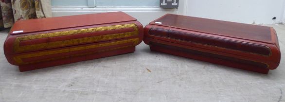 A Chinese red lacquered, geometrically carved and gilded wooden box and cover  8"h  25"w; and