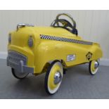 A Burns model pedal car, in the form of a New York yellow cab with rubber wheels  33"L overall
