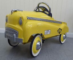 A Burns model pedal car, in the form of a New York yellow cab with rubber wheels  33"L overall