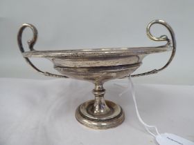 An Edwardian silver, twin handled sweet dish, elevated on a knopped pedestal  indistinct maker's