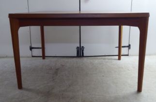 A circa 1970s teak draw leaf dining table by Henning Kjærnulf for Vejle Stole Mobelfabrik of