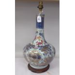 An early 20thC Chinese porcelain bottle vase design table lamp, decorated in colours and