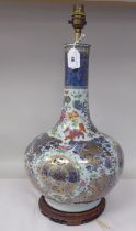 An early 20thC Chinese porcelain bottle vase design table lamp, decorated in colours and