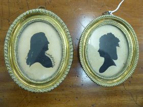 Two similar 19thC oval profile portrait head and shoulders portrait miniature silhouettes, each