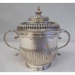 A Georgian style silver porringer with demi-reeded ornament and opposing S-shape bead bordered, twin
