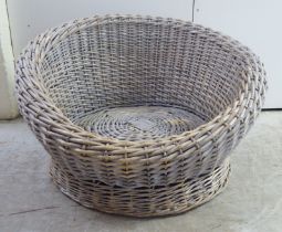 A wicker dog basket  32"w