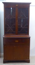 An Edwardian style satinwood, string inlaid, crossbanded mahogany cabinet bookcase, the upper part