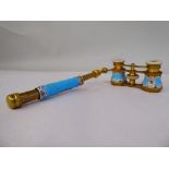 A pair of late 19thC gilt metal and enamelled opera glasses with decoratively painted and inland