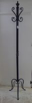 A modern walnut and cast black painted metal hat/coat stand  70"h