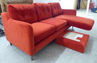 A modern three person settee, upholstered in bright red fabric, raised on pegged feet  82"w  32"deep