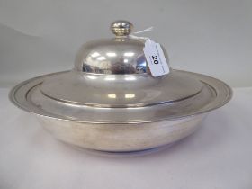 A silver coloured metal serving dish and domed cover with a knop finial  stamped 900  12"dia  (