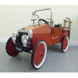 A Duddy painted model pedal car, in the form of a fire truck with rubber wheels  37"L overall