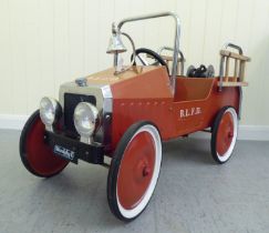 A Duddy painted model pedal car, in the form of a fire truck with rubber wheels  37"L overall