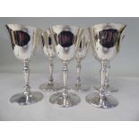 A set of six silver inverted bell design wine goblets, each elevated on a knopped, tapered stem